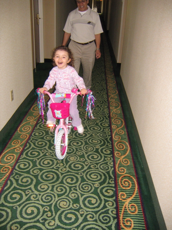 Riding her bike in the hotel. 