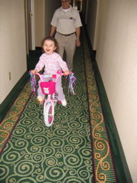 Riding her bike in the hotel. 