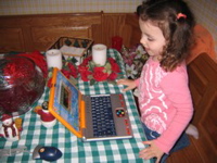 Novali playing with her new laptop. 