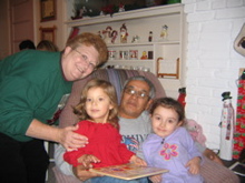 Grandma and Grandpa with two of their granddaughters.