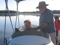 My grandpa teaching Novali how to drive the boat. 