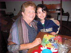 Novi in her Notre Dame fleece playing games with grandma.