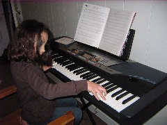 Playing the piano.