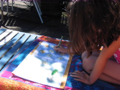 Novi worked on her cursive and learning how to tell time in the shade by the pool. 