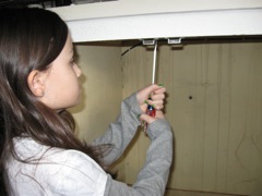 Fixing the cabinet hardware...